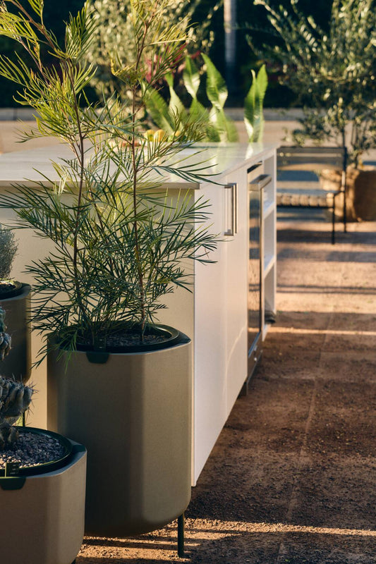 Beautiful self-watering planters in outdoor courtyard